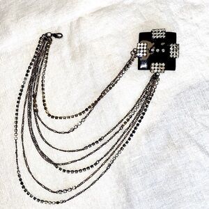 Patent leather and rhinestone brooch